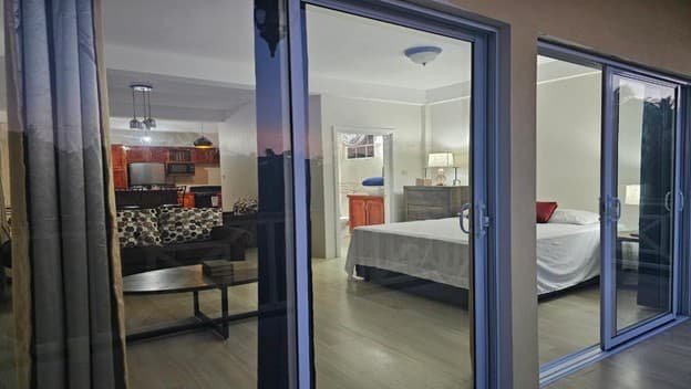 Cozy Royal suite interior at evening with sliding glass doors