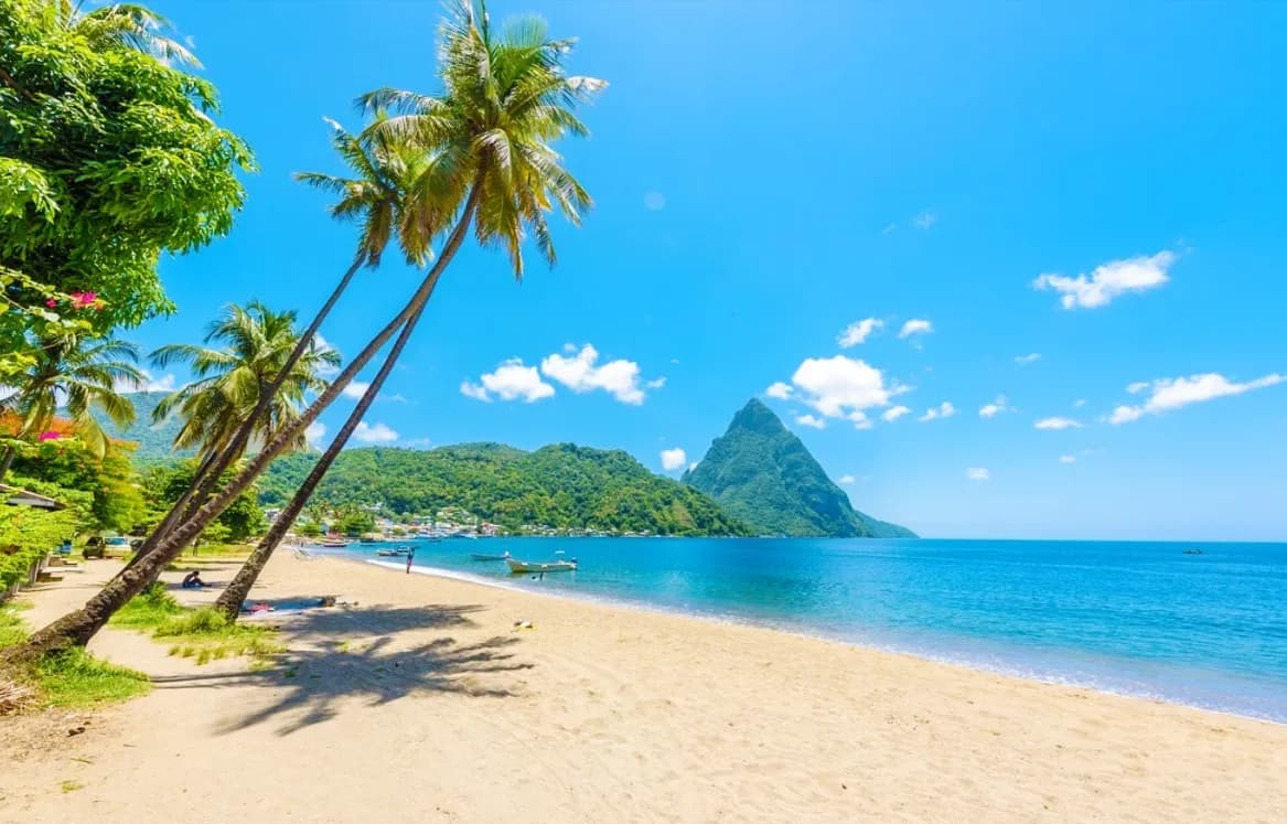 Tropical beach with turquoise water and green hills