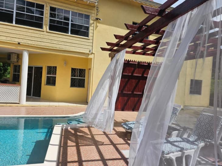 Pool, garden, and outdoor seating at Royal Escape Villa